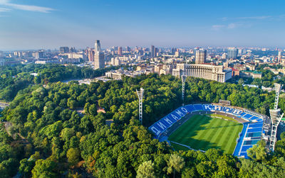 High angle view of buildings against blue sky