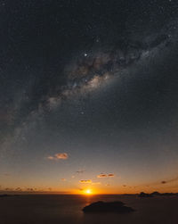 Scenic view of sea against sky at night