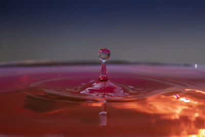 Close-up of drop falling in water