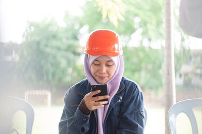 Young woman using mobile phone