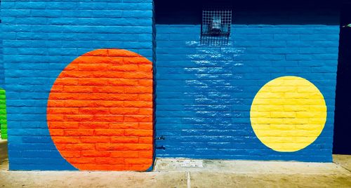 Directly above shot of orange on table against wall
