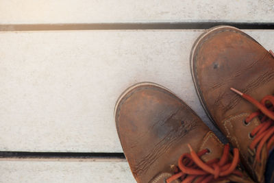 Low section of shoes on floor