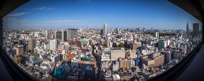 Aerial view of cityscape against sky