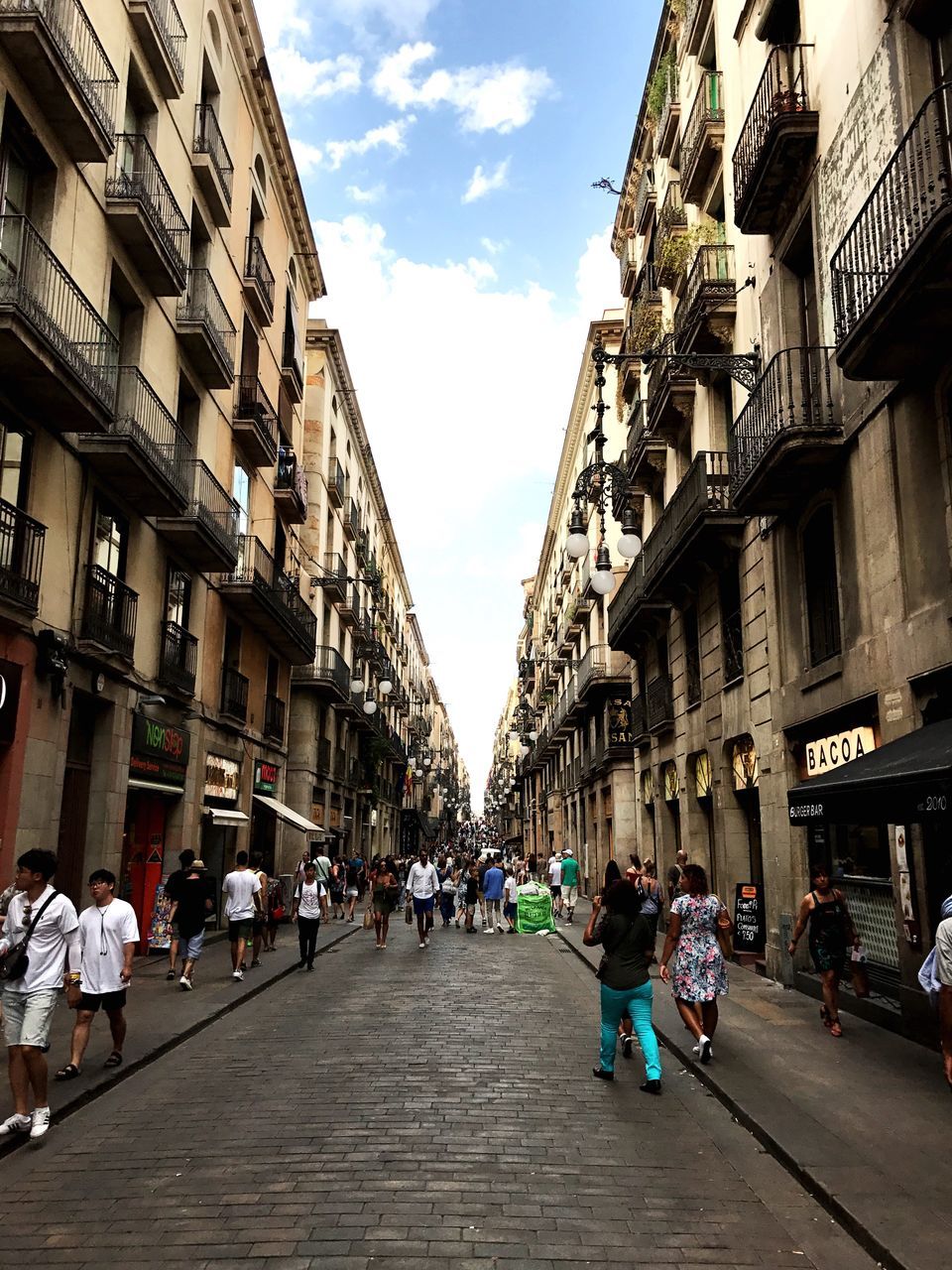 building exterior, architecture, real people, built structure, sky, large group of people, street, day, outdoors, women, men, city, people