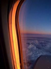 Close-up of window against sky during sunset