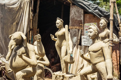 Low angle view of statues against building