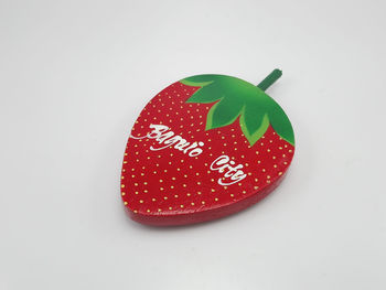 Close-up of strawberry over white background