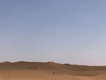 Scenic view of desert against clear sky