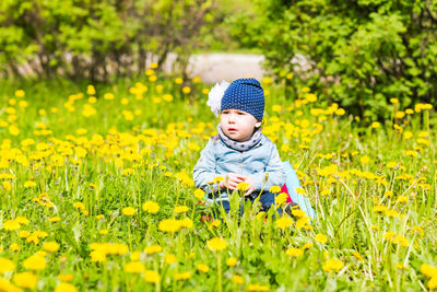 Full length of cute baby girl on field