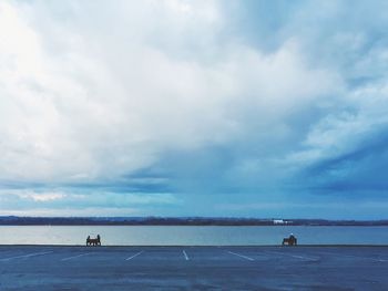 Scenic view of sea against cloudy sky