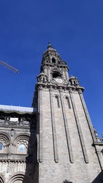 Low angle view of building against blue sky