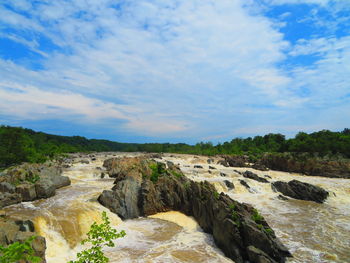 Scenic view of rocks against sky