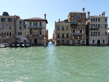 Canal amidst buildings in city