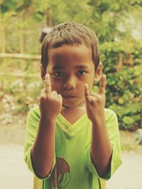 Portrait of boy gesturing