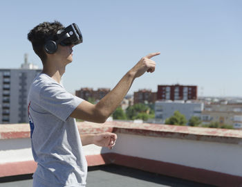 Virtual reality experience young man having a funny moment