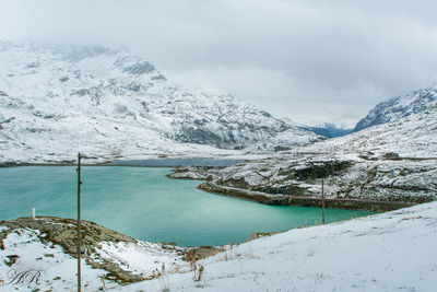 Scenic view of mountains against sky during winter