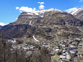 Aerial view of snowcapped mountains against sky