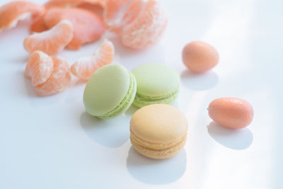 Close-up of multi colored candies against white background