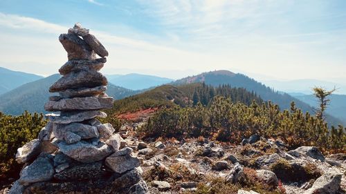 Stack of rocks against sky