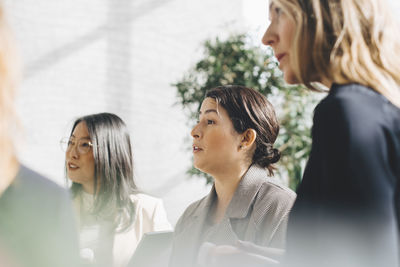 Female professionals networking in meeting at office