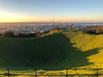 Aerial view of city against sky during sunset