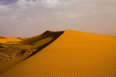 Scenic view of desert against sky