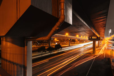 Light trails on road in city at night