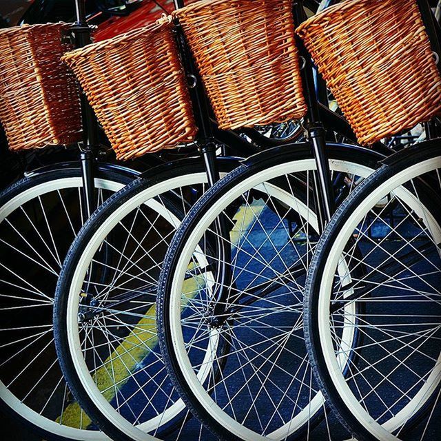 large group of objects, abundance, high angle view, indoors, arrangement, basket, repetition, full frame, no people, stack, in a row, pattern, still life, order, roof, backgrounds, retail, day, variation, wicker