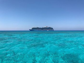 Scenic view of sea against clear blue sky