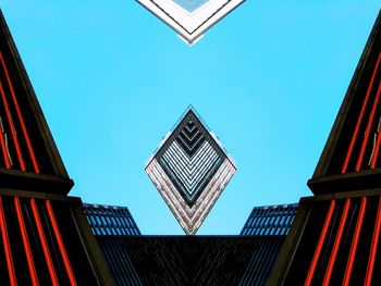 Low angle view of buildings against clear blue sky