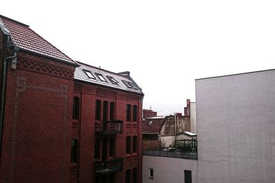 Low angle view of buildings against clear sky