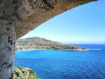 Scenic view of sea against blue sky