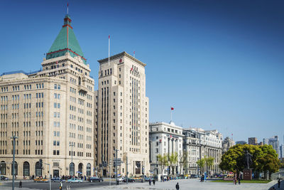 View of buildings against clear blue sky