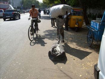 Man riding bicycle on street