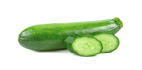 Close-up of green pepper against white background