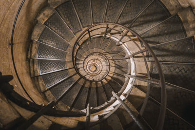 Directly below shot of spiral staircase in building