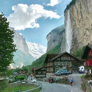 Panoramic view of buildings and mountains against sky