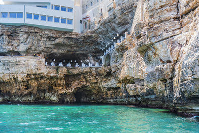 Scenic view of sea by buildings