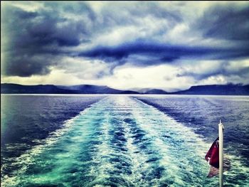 Scenic view of sea against cloudy sky