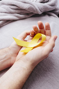 Close-up of hand holding fruit