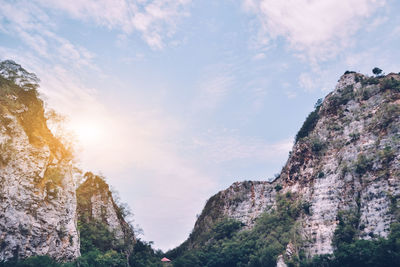 Low angle view of rock formations against sky