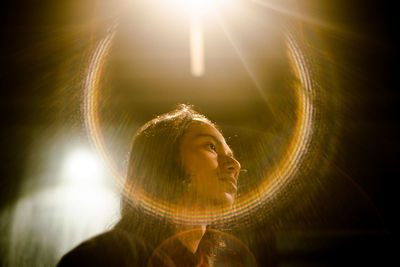 Portrait of young woman with light painting