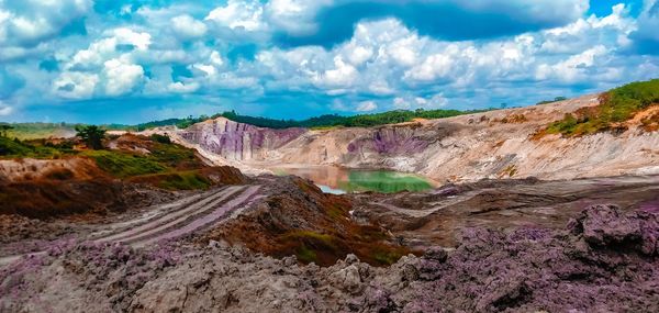 Panoramic view of land and mountains against sky