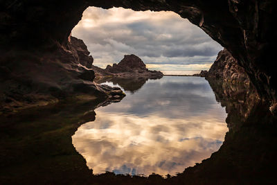 Scenic view of rock formation against sky during sunset