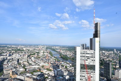 High angle view of modern buildings in city against sky