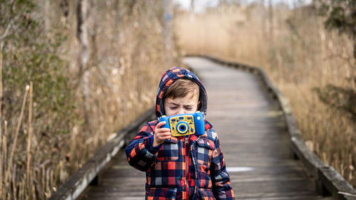 A boy captures a picture.