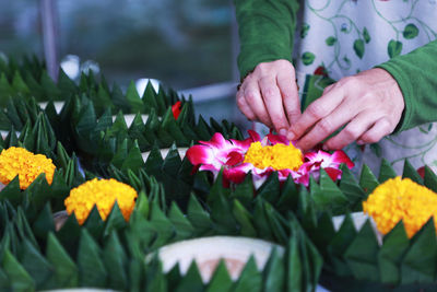 Close-up of woman holding bouquet of flower