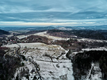 Winter landscape with mountains covered with forest