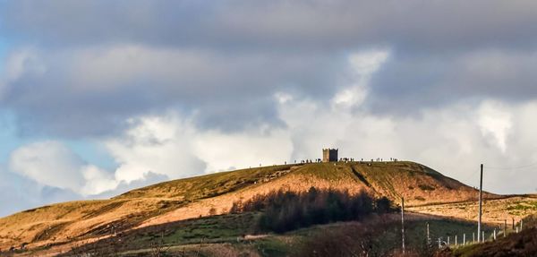 Panoramic view of building on mountain against sky