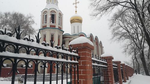 Low angle view of building against sky during winter